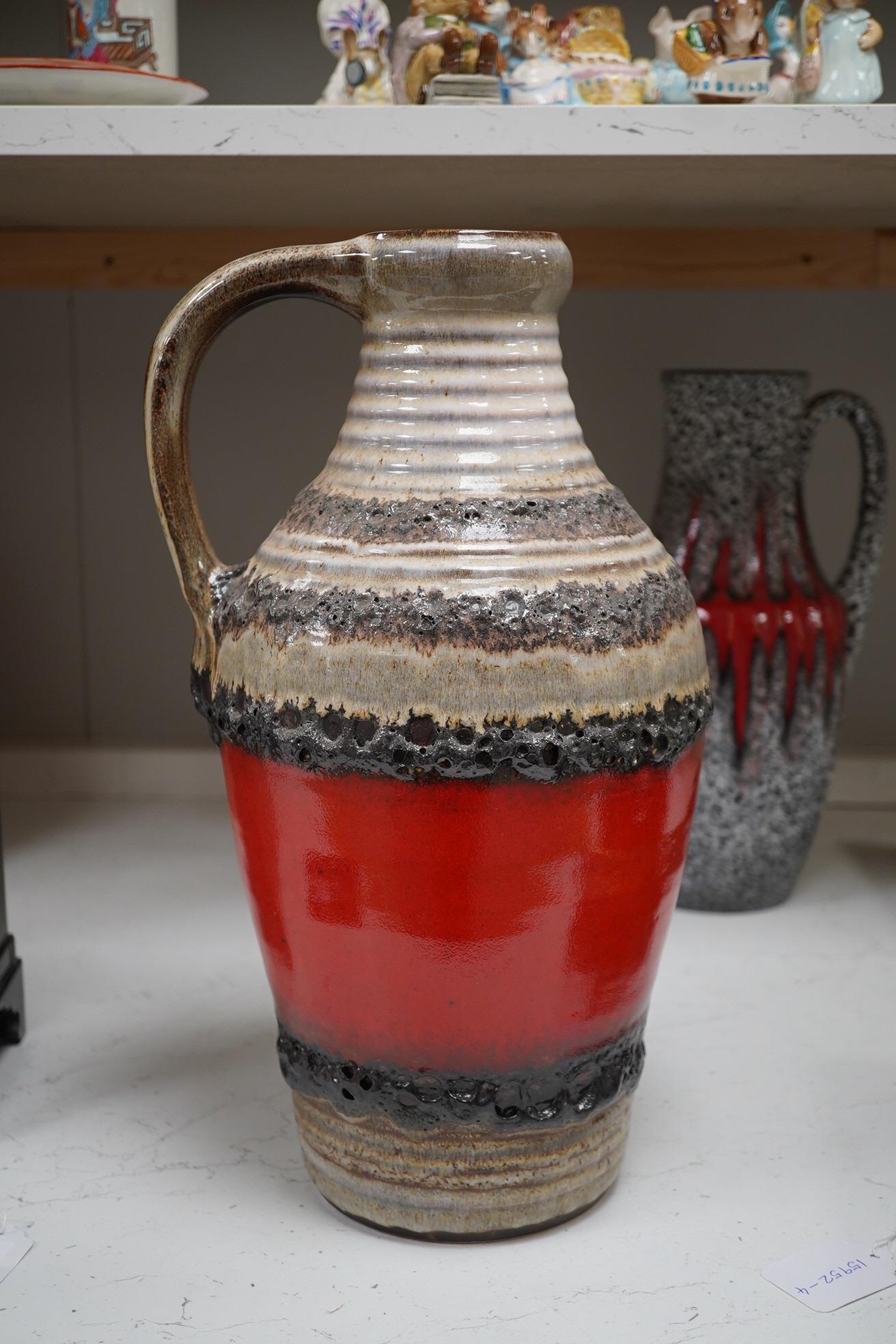 Three large West German vases including Bay and two volcanic glazed (fat lava), 42cm high. Condition - good